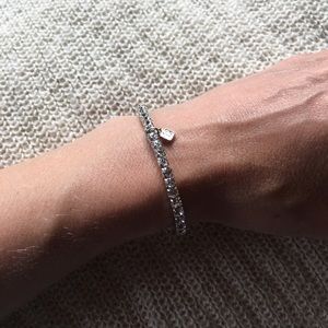 Cubic zirconia tennis bracelet with charm